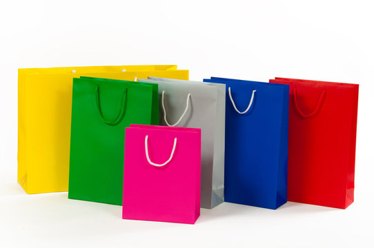 Multicolored paper shopping bag isolated on white