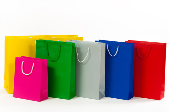 Multicolored paper shopping bag isolated on white