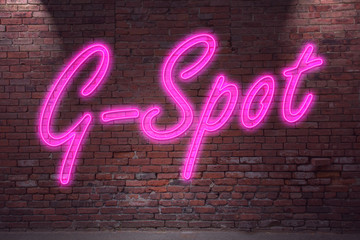 Leuchtreklame G-Spot an Ziegelsteinmauer - obrazy, fototapety, plakaty