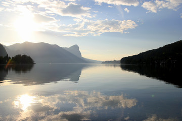 Travel to Attersee, Austria. The view on the lake with the mountains on the background in the sunny day.