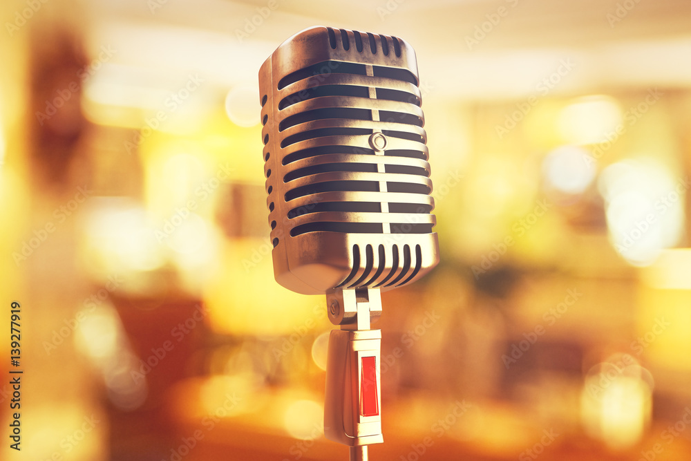 Poster microphone on bokeh background closeup