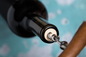 Removing the Cork from a Bottle of Red Wine