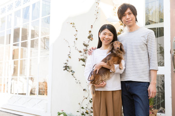 Fototapeta na wymiar portrait of young asian couple with dog