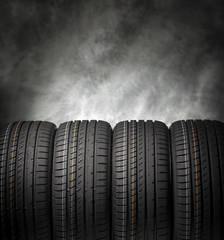 Car tires on a dark background. © Denis Rozhnovsky