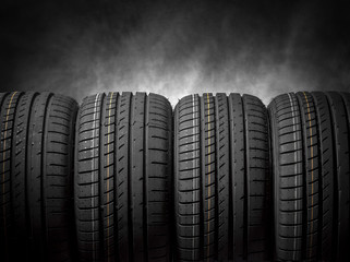 Car tires on a dark background.