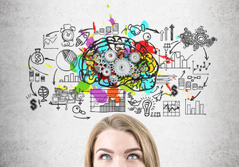 Head of blond woman, brain with gears