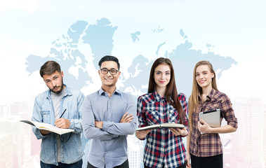 Young business team and world map