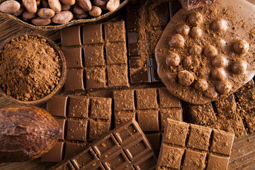 Dark and milk chocolate bar on a wooden table