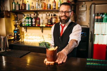 Barkeeper show attractive alcohol cocktail