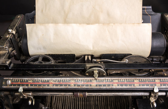 Old typewriter mechanism with inserted paper