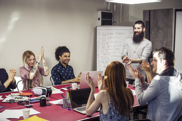 Businesspeople applauding at meeting
