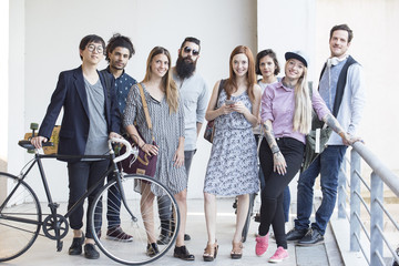 Group of hip professionals standing together outdoors