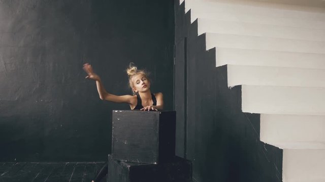 Modern beautiful teenage girl dancer perfomance contemporary dance in ballroom indoors