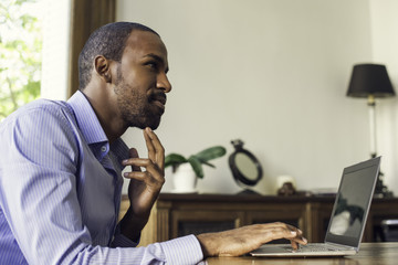 Man using laptop computer for online investment opportunities
