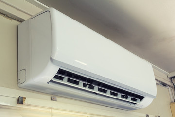 Air conditioner (AC) indoor unit or evaporator and wall mounted. That is part of mini split system or ductless system type. For removing heat and moisture from room. Including humidity control. - obrazy, fototapety, plakaty