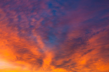 Fototapeta na wymiar Fiery vivid sunset sky clouds