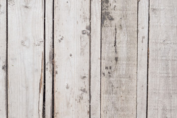 Background old vertical gray wooden planks. Close up old wood texture
