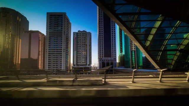 sun light dubai city famous metro line ride side panorama 4k time lapse uae
