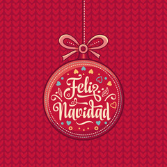 Obraz na płótnie Canvas Feliz Navidad. Red Christmas ball with good wishes in Spanish. 