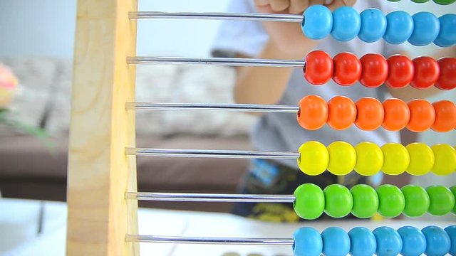 Close up shot asian little girl playing abacus