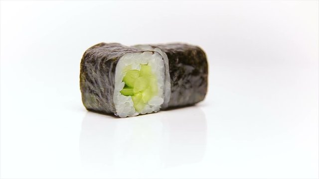 Kappa maki vegetarian roll with fresh cucumber rotating isolated in white