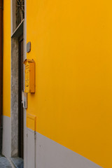 Orange mailbox on an orange wall in Cinque Terre, Italy.