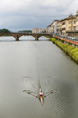 Rower on the Arno River in Florence, Italy. © Andrea Lonas