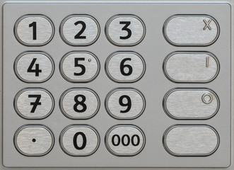 ATM keypad. Closeup metal keyboard of automated teller machine.