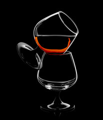Silhouette of brandy snifter glass isolated on black background.