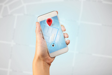 Female hand holding smartphone
