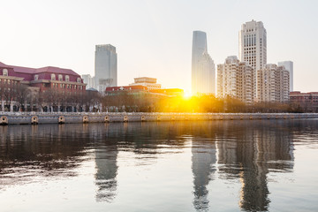 River And Modern Buildings Against Sky in Tianjin,China.