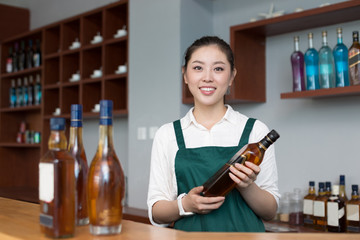 young pretty woman works in cafe