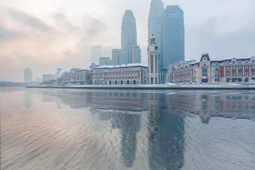 Naklejka premium River And Modern Buildings Against Sky in Tianjin,China.