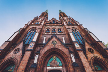 Cathedral of St. Michael the Archangel and St. Florian the Martyr wide angle view. St. Florian's Cathedral, catholic church of gothic style and historic landmark in Praga district in Warsaw, Poland. - obrazy, fototapety, plakaty