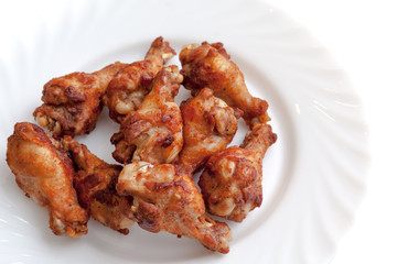 Fried chicken  wings ready to serve on the plate white background
