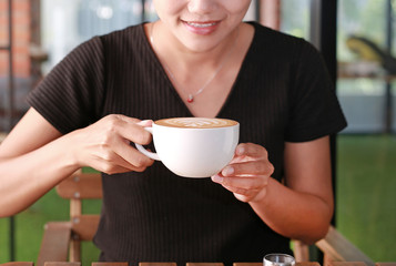 Woman drinking hot coffee in the morning.