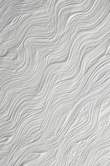The texture of the plaster and putty on a white wall. The background for a festive greeting cards....