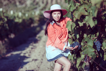 Girl with a jug in the vineyards