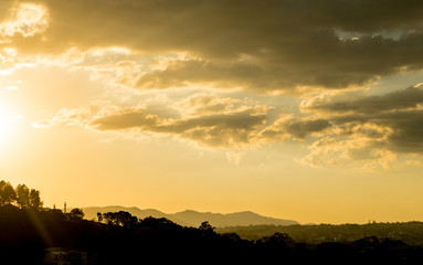Sunny sky with clouds in the background.