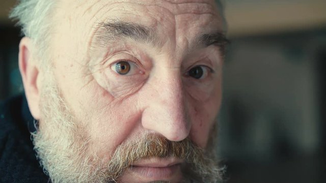 Shhh, old senior staring to camera and puts fingers to lips 4K