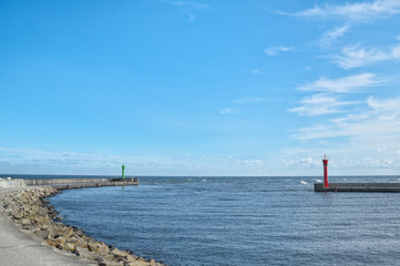 Port entrance on Baltic sea. Summer landscape with clear blue sky.