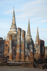 Fototapeta premium Cloudy morning at the ruins of the wihan Buddhist temple Wat Phra Si Sanphet. Ayutthaya. Thailand