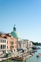 VENICE, ITALY - June 30, 2016.View of water street and old buildings in Venice on June 30, 2016. its entirety is listed as a World Heritage Site, along with its lagoon.June 30 VENICE, ITALY