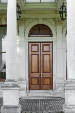 Brown door and columns