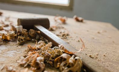 The carpenter was working furniture wood in studio , Soft-focus image