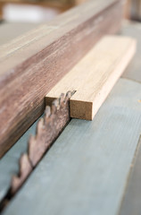 The carpenter was working furniture wood in studio , Soft-focus image
