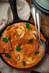 Beef Stroganoff with mushroom in iron pan