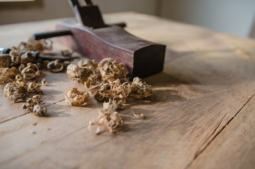 The carpenter was working furniture wood in studio , Soft-focus image