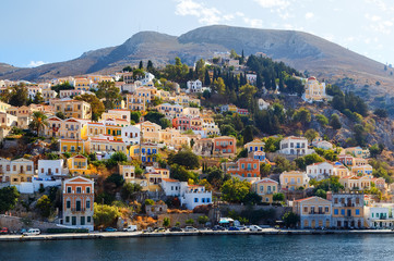Fototapeta premium Greece. Dodecanesse. Island Symi Simi . Colorful houses on rocks