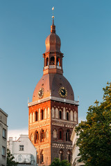 Fototapeta na wymiar Clock On Tower Of Riga Dome Cathedral In Riga, Latvia. Sunny